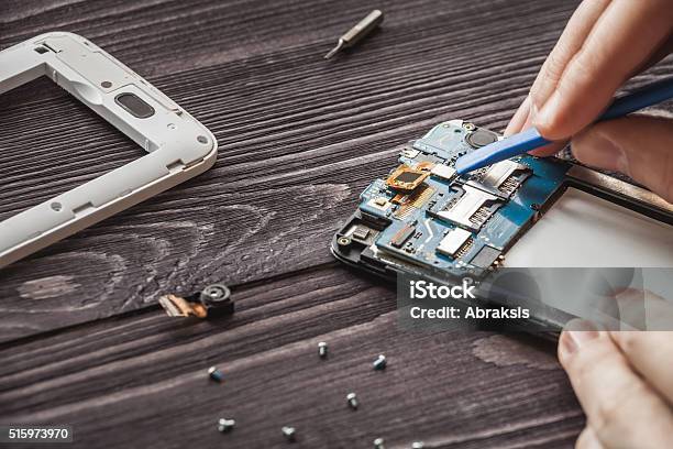 Mobile Phone Repairing Stock Photo - Download Image Now - Telephone, Repairing, Spare Part