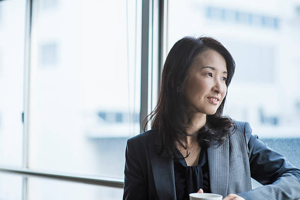 istock Businesswoman taking a coffee break in office 515974316