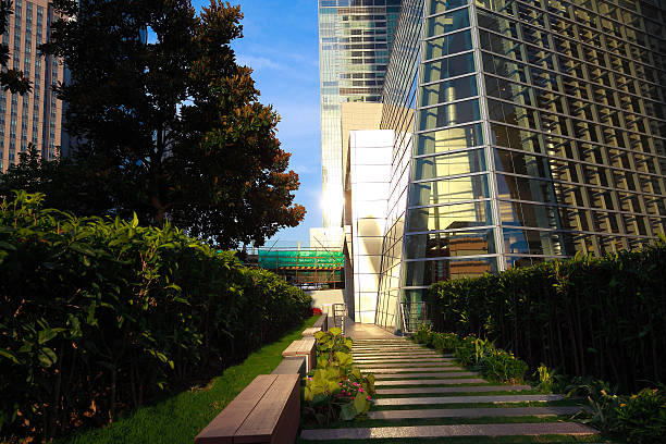 istock Empty marble floor road with modern city glass wall buildings 515974732