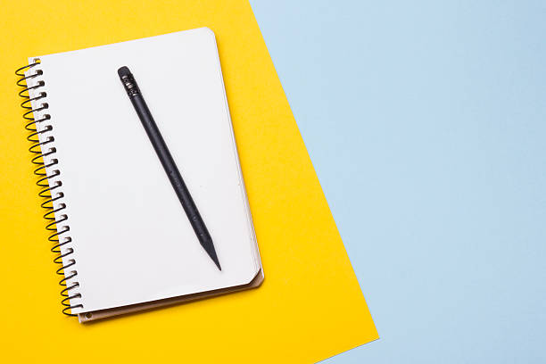 istock Office desk table with supplies top view. Notepad, pen and 515975078