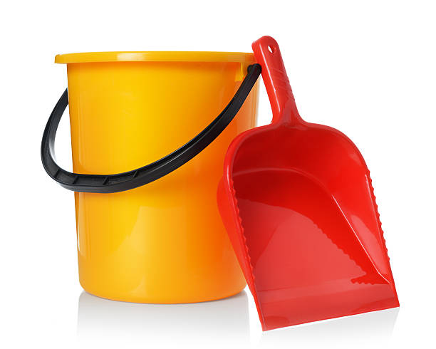 istock Yellow bucket and red scoop isolated on white background 515975102