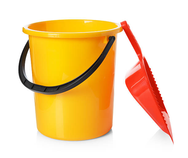 istock Yellow bucket and red scoop isolated on white background 515975184