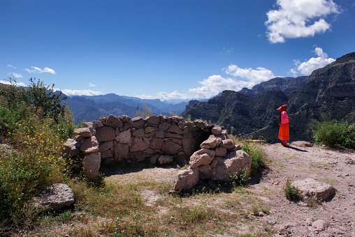 Creel, Mexico - October 10, 2014: Indigenous woman is seen wering traditional Tarahumara outfit in Copper Canyons in Chihuahua, Mexico