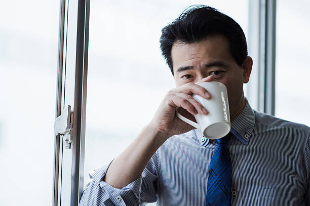 istock Businessman taking a coffee break in office 515975934