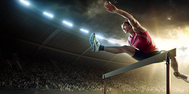 mężczyzna lekkoatleta biegi płotkarskie na wyścig sportowy - hurdling hurdle competition endurance zdjęcia i obrazy z banku zdjęć