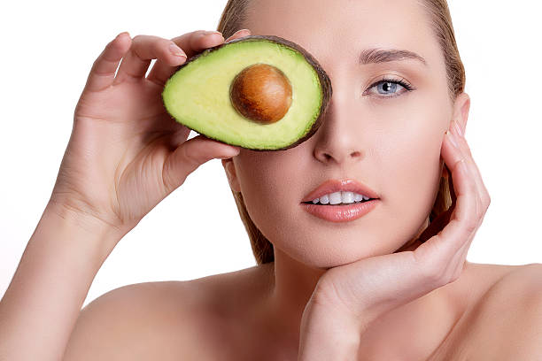 istock young happy woman showing an avocado 516001608