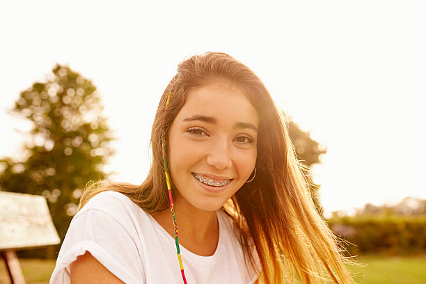 Life is better when you're smiling Portrait of a teenage girl enjoying the outdoors cute teen pic stock pictures, royalty-free photos & images