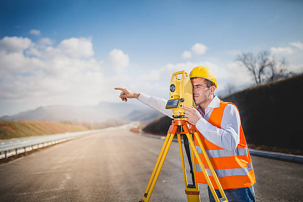 istock Land surveyor with total station 516005416