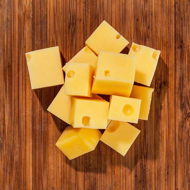 istock Cheese isolated and served on wooden rustic board 516006090