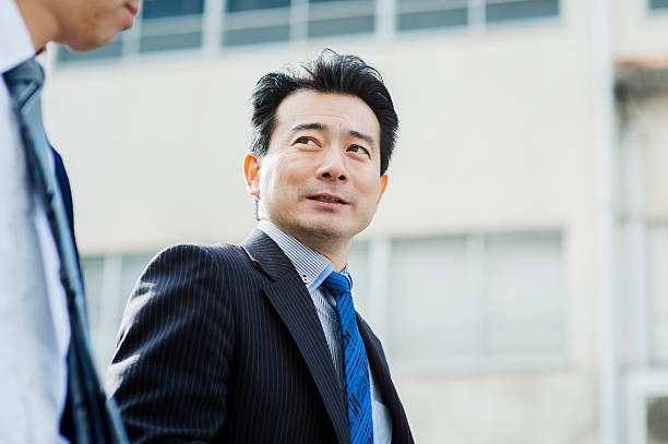 istock Businessmen walking outside of office 516006686