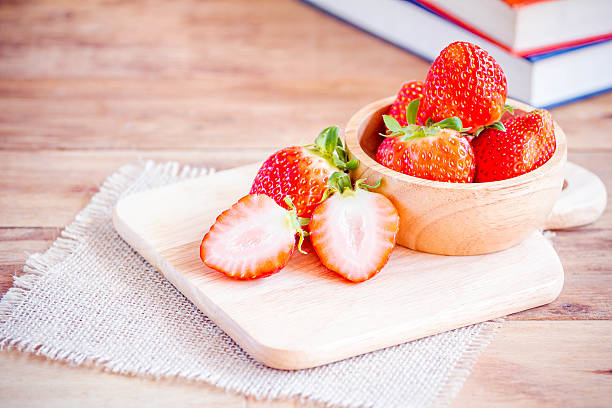 istock Fresh strawberries on wooden table. 516007552