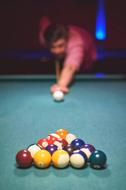 istock Man about to hit the cue ball 516008730