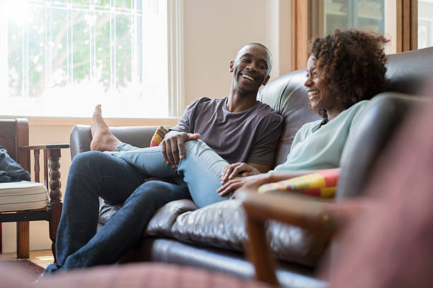 istock Happy couple on sofa at home 516009240