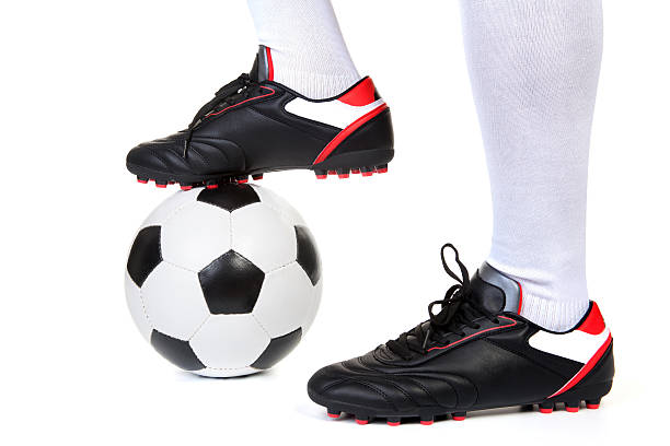 istock Football player with ball on white 516009386