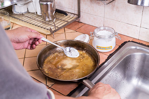 istock Baking soda to soak and remove burnt-on food in pans 516011036