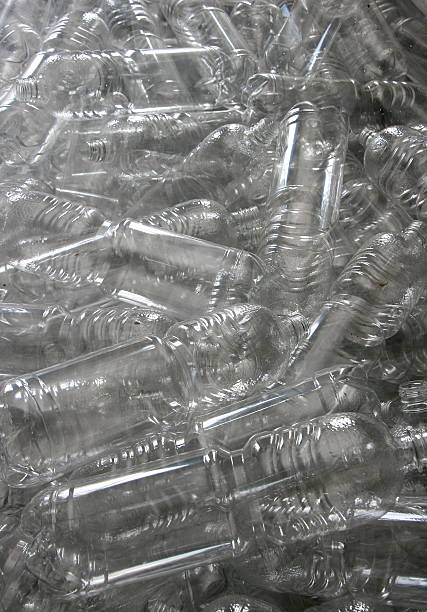 istock Background of transparent plastic bottles pile 516011216