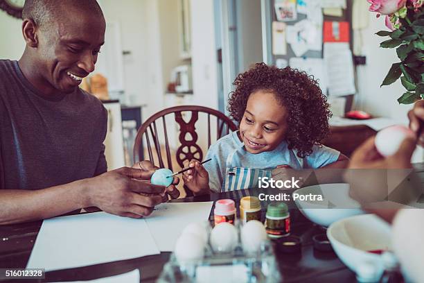 Father And Boy Colouring Easter Egg Together Stock Photo - Download Image Now - Easter, Easter Egg, Family