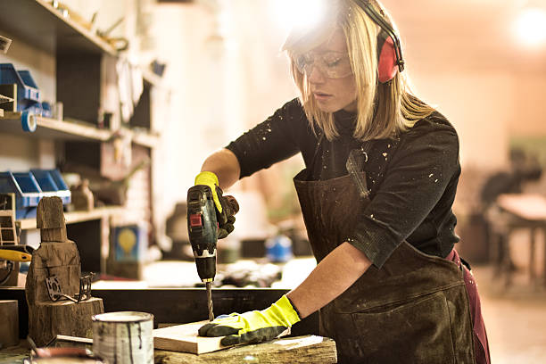 istock Woman with electric drill 516012752