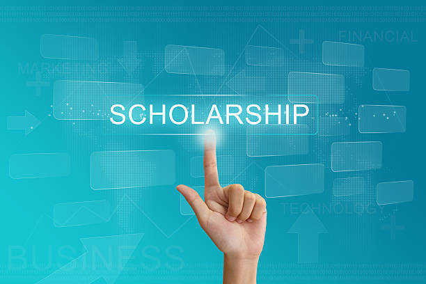 hand press on scholarship button on touch screen stock photo