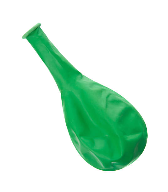 istock Not inflated green air balloon isolated on white background 516015124