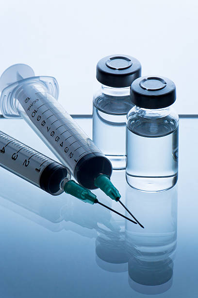 istock medical ampoules and syringe 516015415
