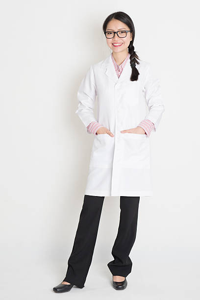 istock Asian Chinese girl in white lab uniform 516016217