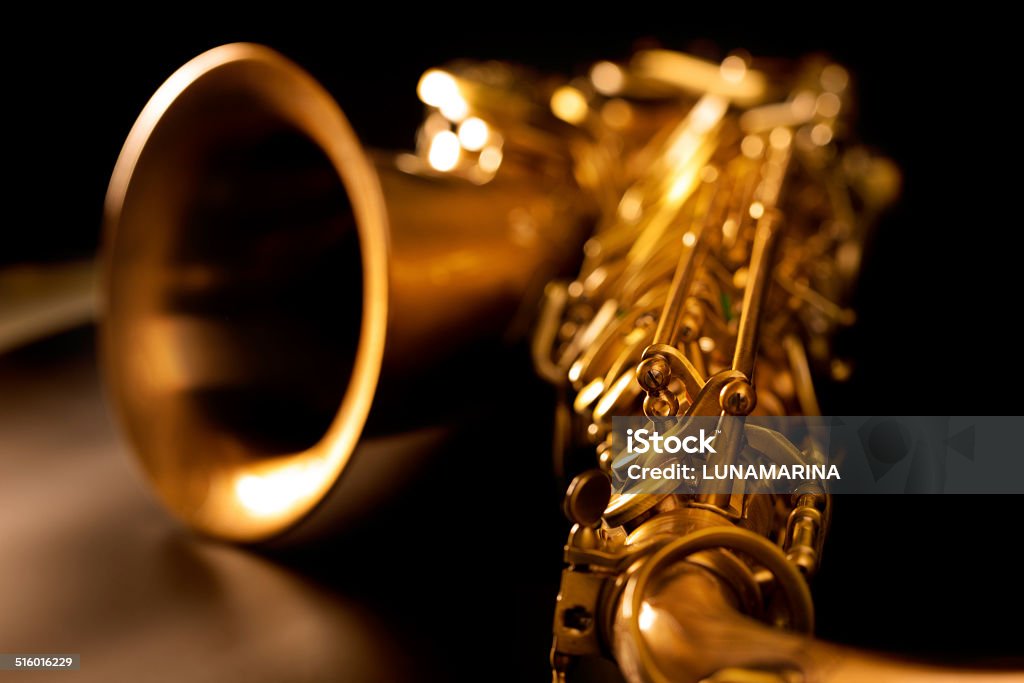 Tenor sax golden saxophone macro selective focus Tenor sax golden saxophone macro with selective focus on black Acoustic Music Stock Photo