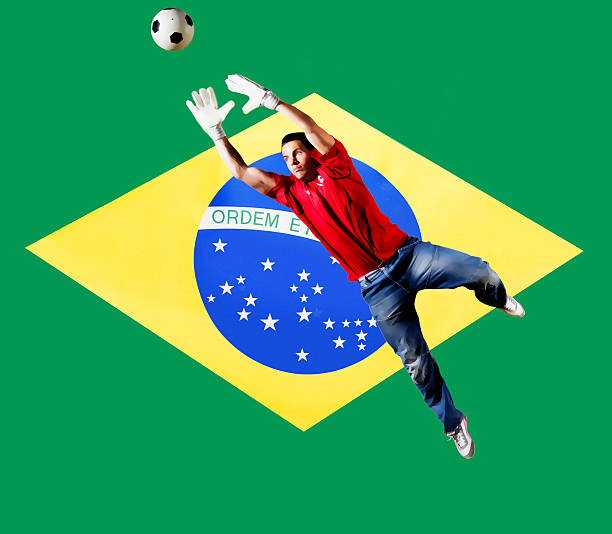 istock Goalkeeper saving ball in front of flag 516016591
