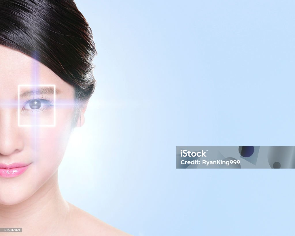 young and beautiful woman eye portrait of woman eye with the virtual hologram on her eyes, laser medicine & technology concept, Accessibility Stock Photo