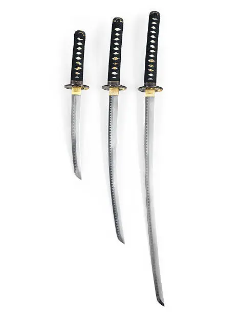 Three Japanese samurai swords, Katana, Wakizashi and Tanto, isolated on white background