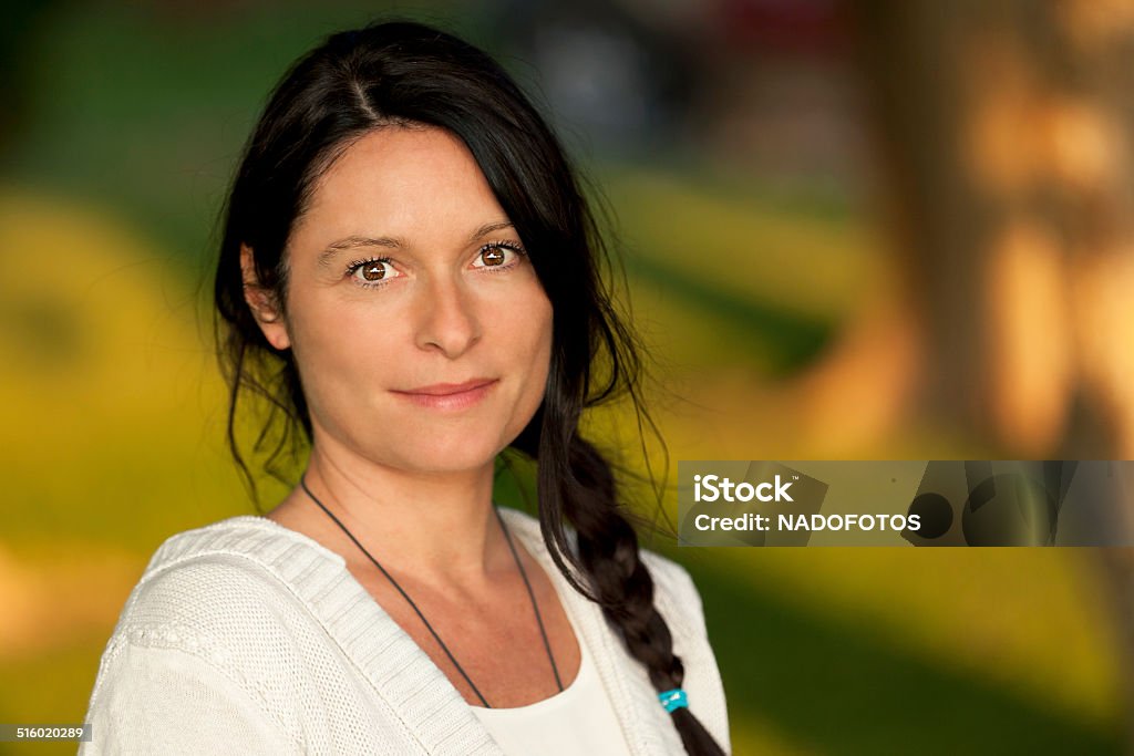 Closeup Of A Serious Mature Woman Serious Mature Woman looking at the camera One Woman Only Stock Photo