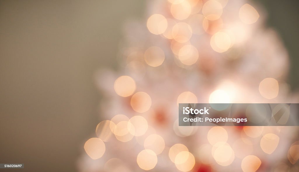 Dreaming of a bright Christmas Defocused shot of a beautifully decorated Christmas tree Christmas Decoration Stock Photo