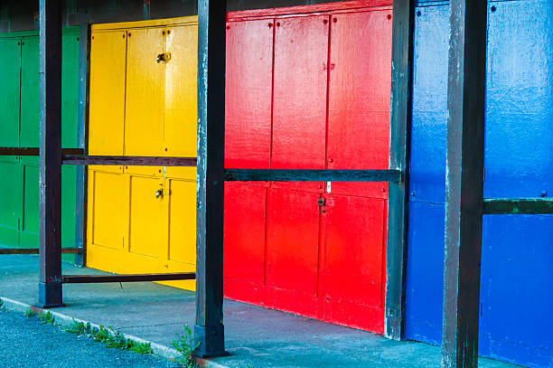 istock View of Bright colored beach huts on summer day 516021339