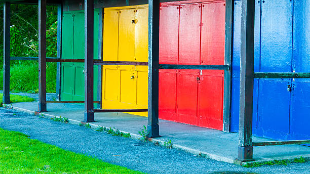 istock View of Bright colored beach huts on summer day 516021347