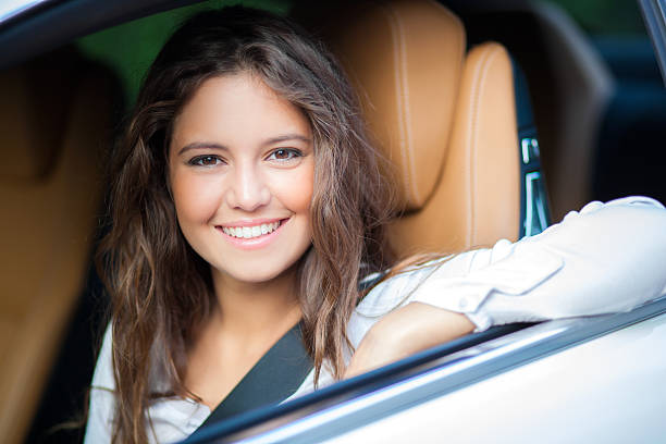 istock Young woman driving her car 516032754