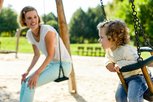 istock On the playground, rocking 516033474