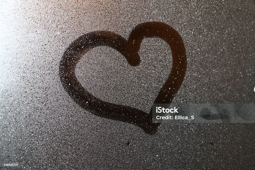 Drown heart on the glass , symbol of love Drown heart on the glass , symbol of love  Adult Stock Photo