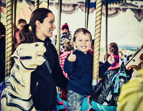 istock Happy Boy and Mother on Carousel - Retro 516036125
