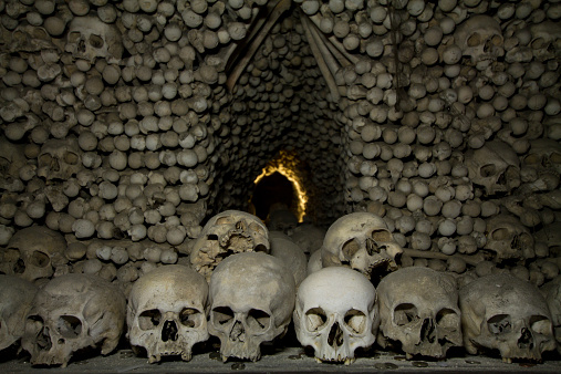 old bones and skulls in the Gothic vault of Kutna Hora. Ossuary.