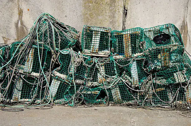 Photo in a port of fishingnets and ropes with sunlight
