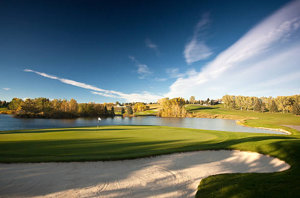 istock Parkland Golf Course Scenic With Water and Sand 516039781