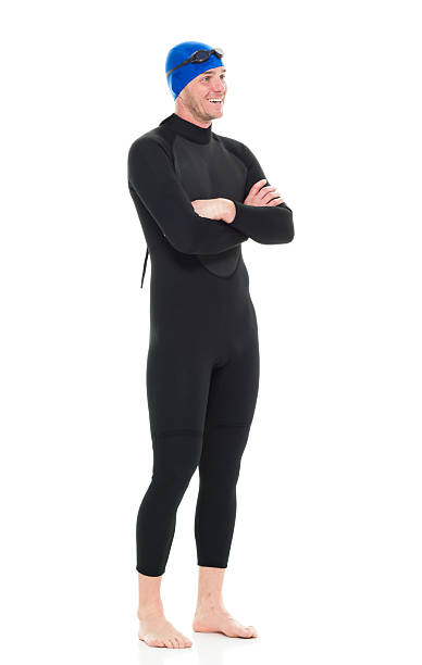 istock Smiling swimmer standing with arms crossed 516040940