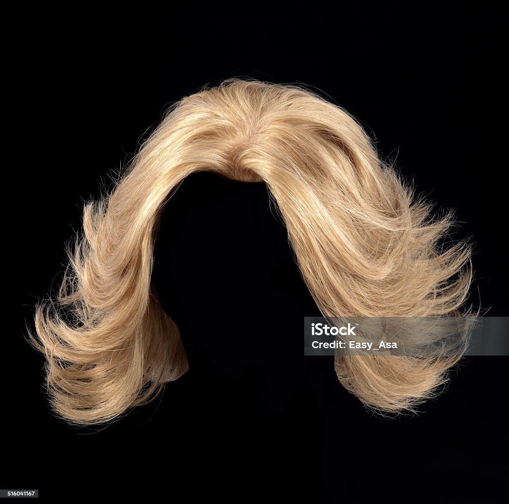 blonde wig blonde wig for women on a black background Wig Stock Photo