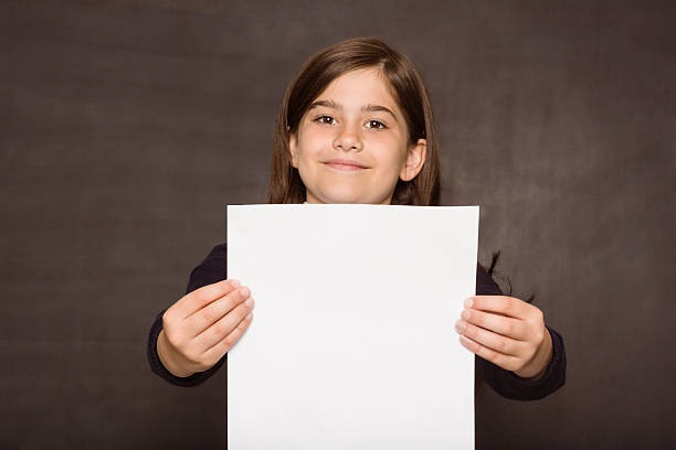 istock Cute pupil showing white page 516041591