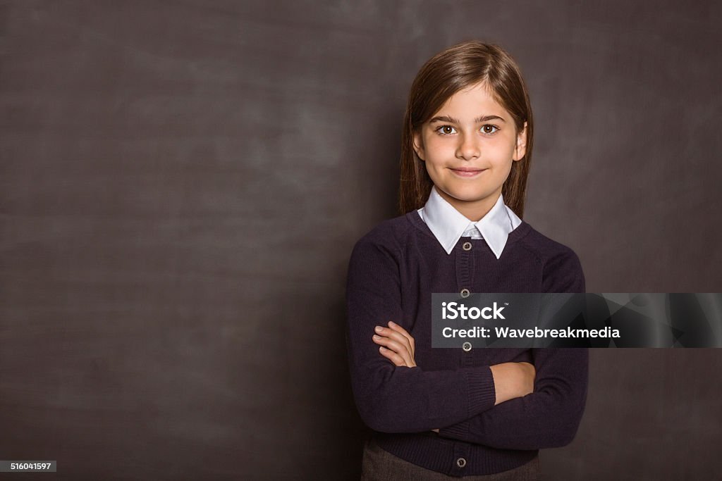 Cute pupil smiling at camera Cute pupil smiling at camera on black background Child Stock Photo