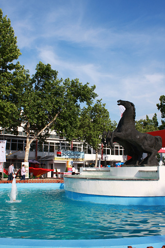 Novi Sad, Serbia - May 13, 2015: Novi Sad, Serbia: May 11, 2015 - Horse fountain on Agricultural Fair in Novi Sad, Serbia. Novi Sad Fair is one of the largest fairs in Southeast Europe. It's located in Novi Sad, Vojvodina the second largest city in Serbia. It is place of one of the largest agricultural fairs in Europe, which visit approx. 600,000 visitors annually. Picture shows main symbol on fair.
