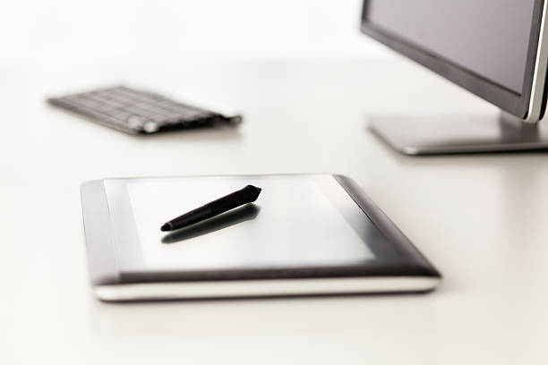 istock Close-up of graphic design tablet on office table 516041763