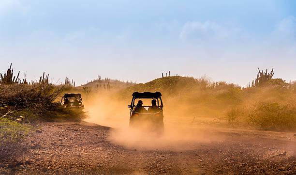 buggies de condução fora de estrada - off road vehicle quadbike desert dirt road imagens e fotografias de stock