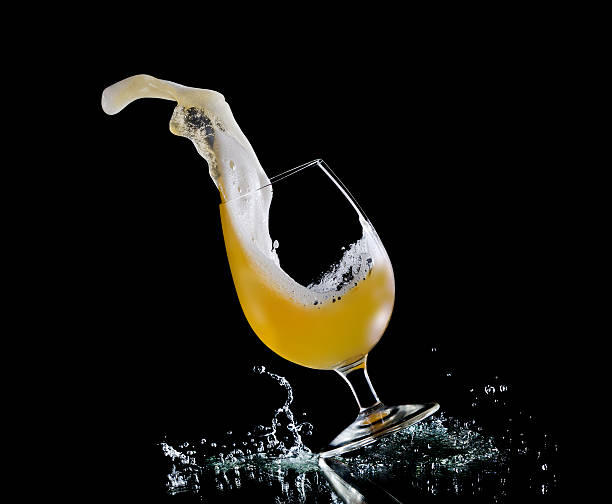 Falling glass of beer stock photo
