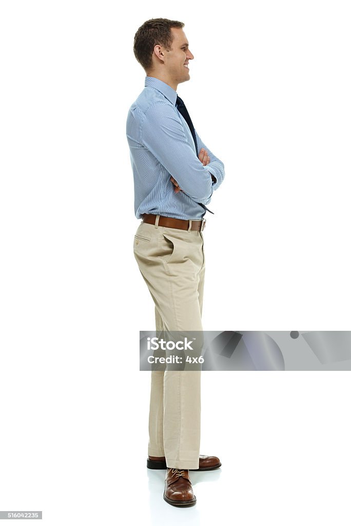 Smiling businessman standing with arms crossed Smiling businessman standing with arms crossedhttp://www.twodozendesign.info/i/1.png 20-24 Years Stock Photo